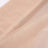 Close-up of soft, sheer fabric in a light beige hue.