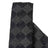 Textured black and gray fabric with geometric patterns.
