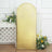 Gold sequin backdrop with floral arrangement for events and photography.