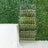 Clear acrylic champagne tower display with glasses filled with champagne.