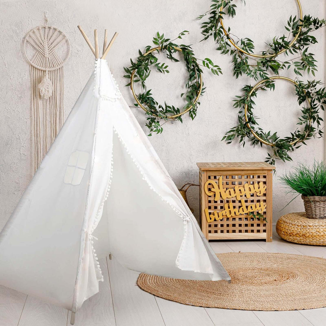 Kid's white play tent with decorative elements in a cozy room setting.