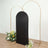 Black backdrop with gold arch stands and floral arrangements