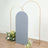 Gray backdrop with gold arch stands and floral arrangements