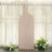 Soft beige backdrop with gold arches and floral arrangements.
