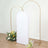 White backdrop with gold arch and floral arrangements