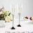 Elegant champagne flutes with sleek metallic bases and clear bowls.