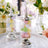 Decorative glass jars filled with pastel-colored candy on a tray.