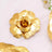Gold metallic flower embellishment for crafts or decor. #whtbkgd