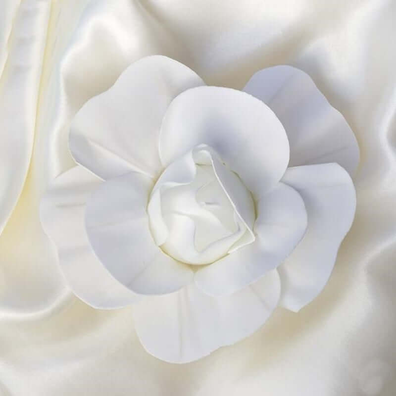 White flower decoration on soft fabric backdrop. #whtbkgd