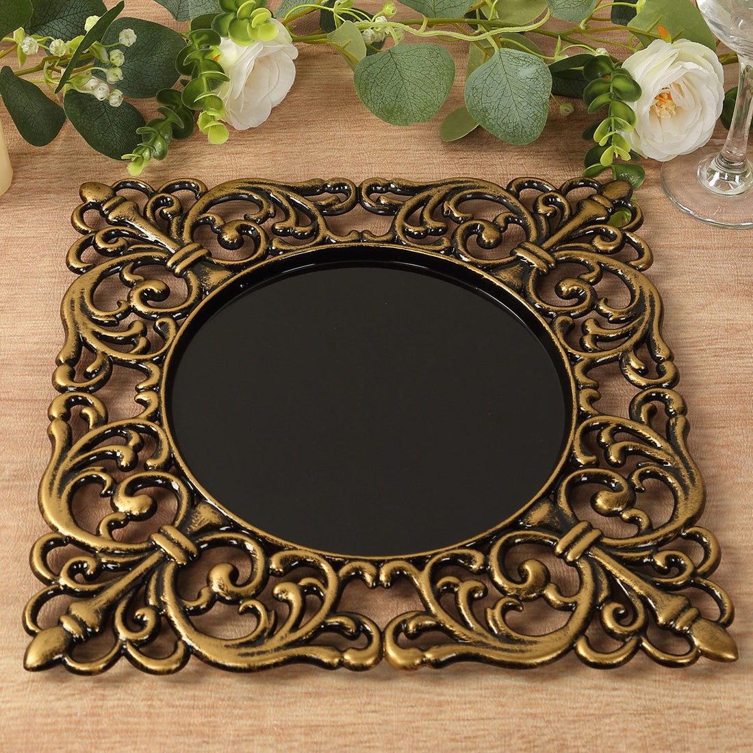 Decorative vintage-style mirror with ornate golden frame.