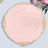 Pink decorative plate with gold trim on a plain background.