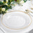 Elegant clear plate with gold beaded rim on a dining table setting.