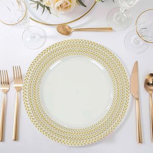 Elegant gold-patterned dinner plate on a stylish table setting.