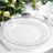 Clear charger plate with beaded rim on a table setting.