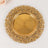 Gold ornate decorative plate with intricate design and fluted center.