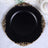 Elegant black plate with ornate gold rim design.