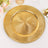 Gold decorative charger plate with intricate swirl design.