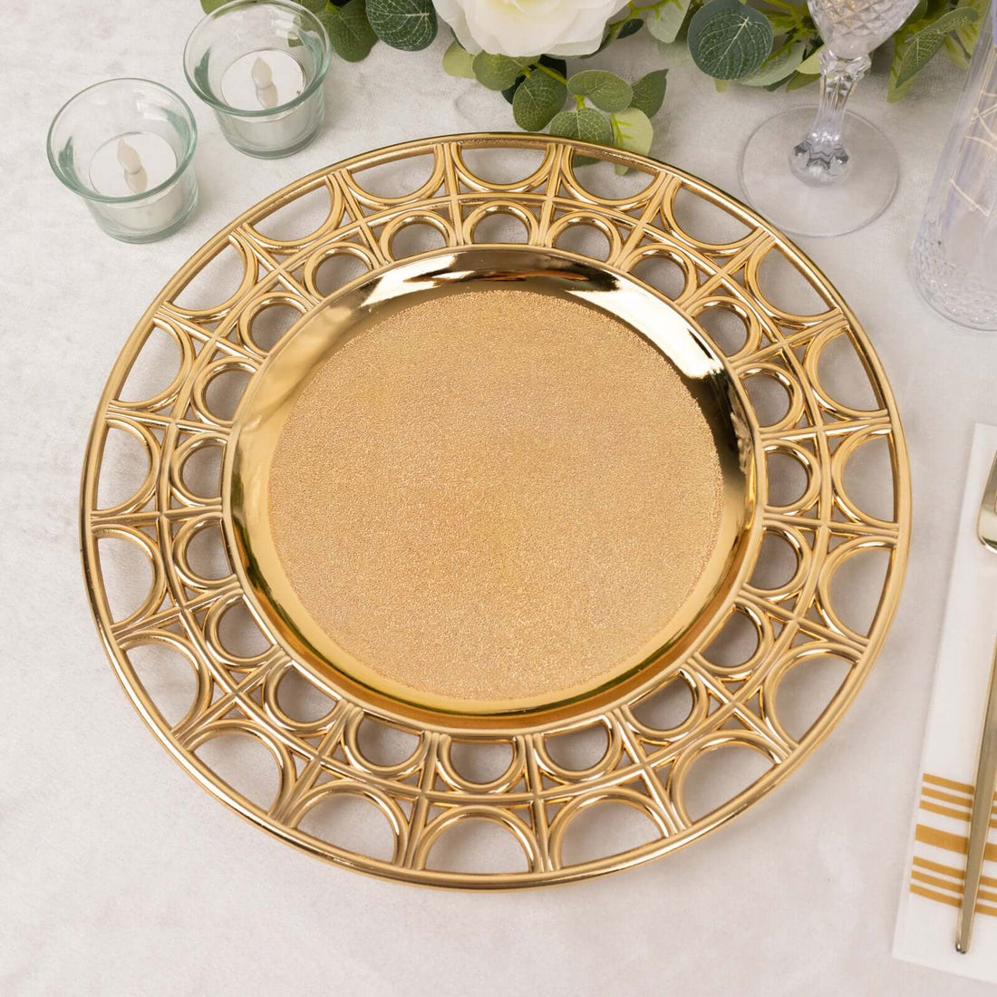 Gold decorative charger plate with intricate design, perfect for elegant table settings.