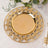 Gold decorative charger plate with intricate design, perfect for elegant table settings.