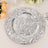 Silver decorative plate with geometric patterns on a table setting.