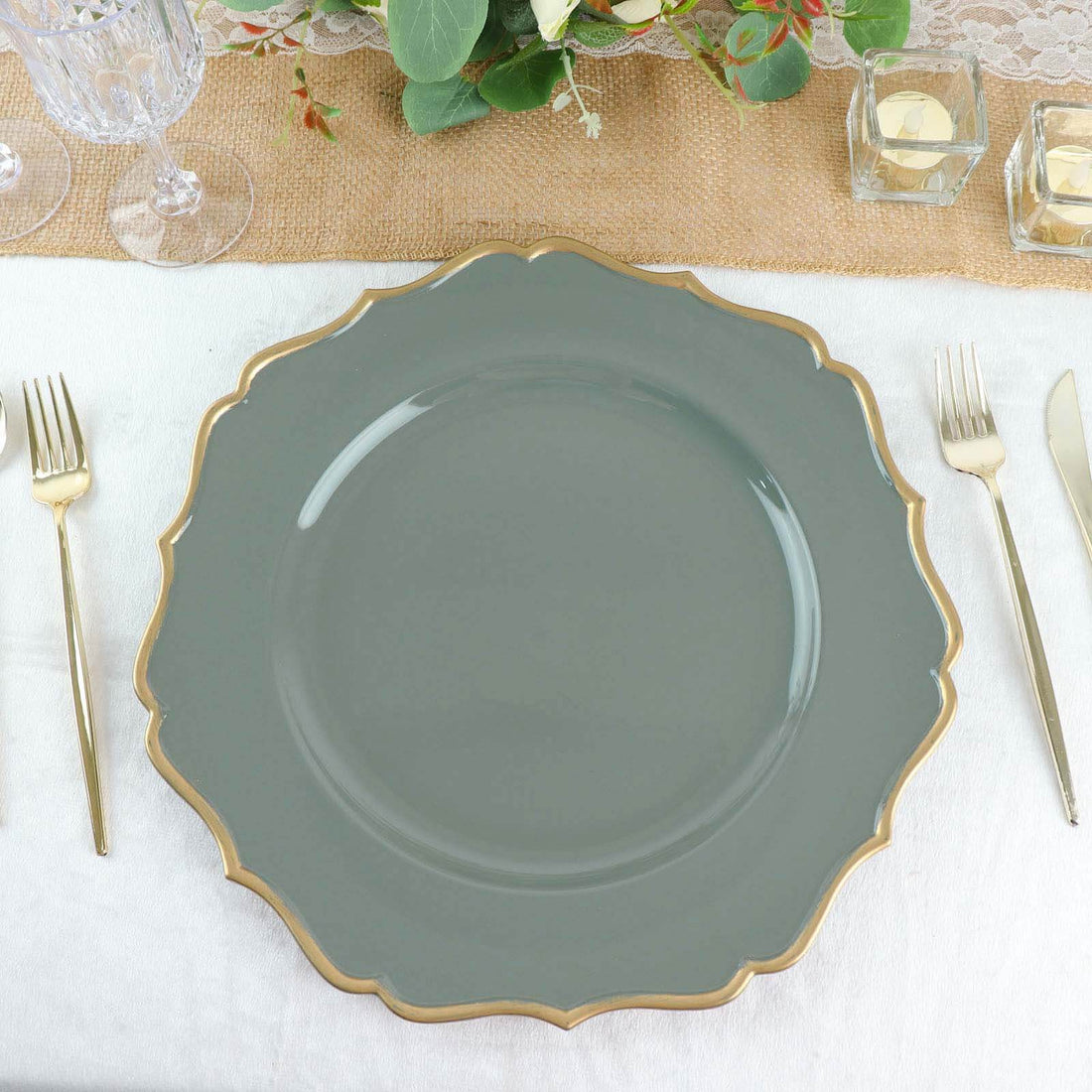 Gray scalloped dinner plate on a beautifully set table.