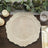Textured wooden charger plate on a rustic table setting with greenery