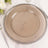 Elegant glass charger plate with beaded rim on a neutral background.