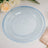 Elegant blue glass plate with beaded edge design.