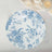Blue floral design plate on a white background.