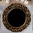 Elegant ornate gold charger plate on a table setting.