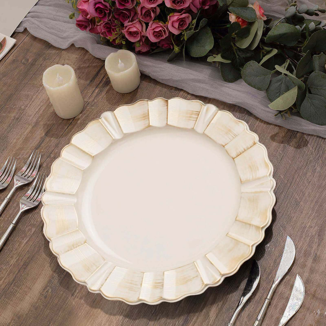 Elegant scalloped edge dinner plate on a rustic wooden table.