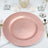 Rose gold charger plate on a table setting with elegant decor.