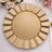 Gold decorative charger plate with a scalloped edge.