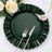 Green scalloped plate with silver fork and knife, surrounded by flowers.