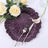 Purple textured plate with fork and knife, adorned with decorative roses.