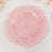 Red textured decorative plate with a ruffled edge on a plain background