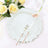 Elegant textured dinner plate with rose gold cutlery and floral accents.