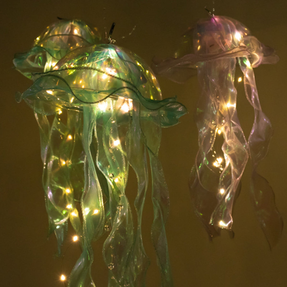 Illuminated jellyfish decorations with colorful lights.