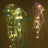 Illuminated jellyfish decorations with colorful lights.