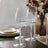 Set of three elegant clear glass stemware on a dining table.