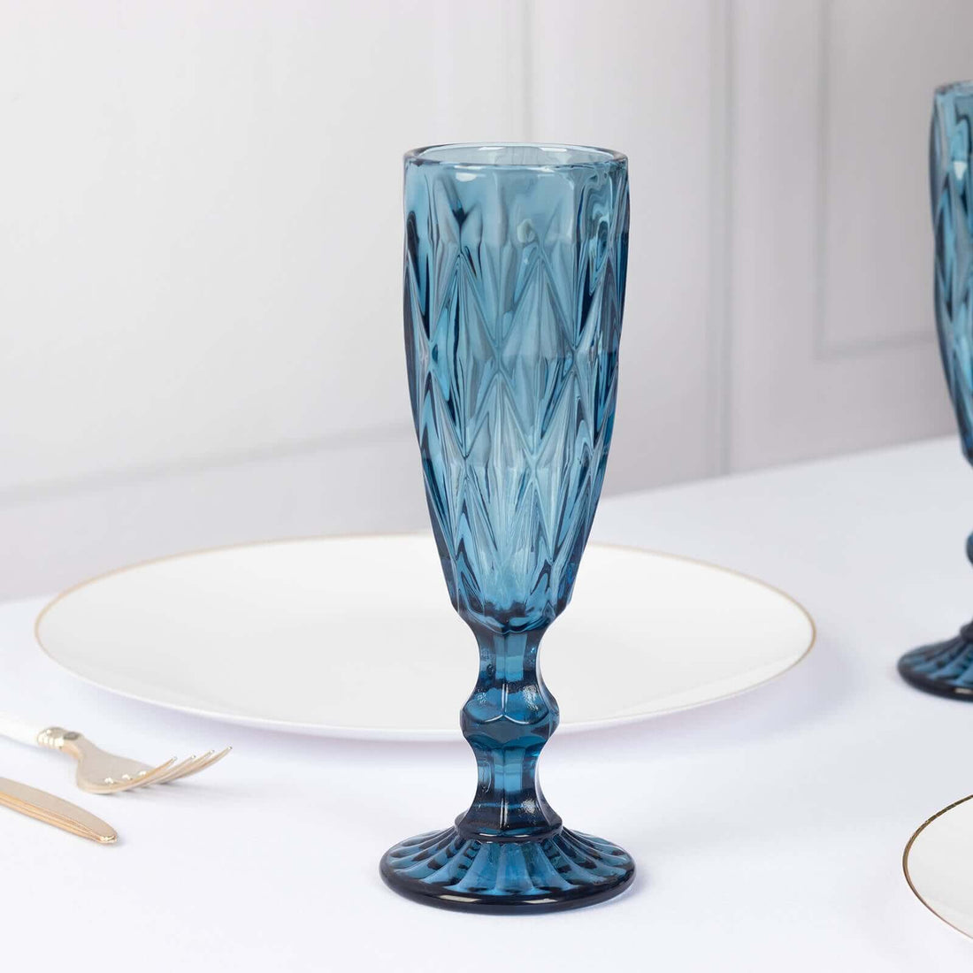 Blue decorative glass on a white table setting