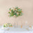 Elegant floral arrangement in a clear vase on a dining table.