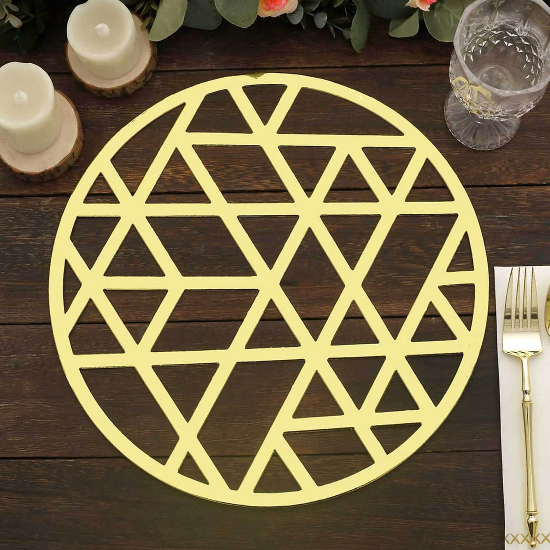 Geometric gold placemat on a wooden table.