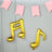 Gold musical note balloons with pink banner in the background.