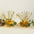 Gold starburst centerpieces for celebrations and events.
