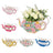 Colorful decorative teapots with floral designs, perfect for home decor.