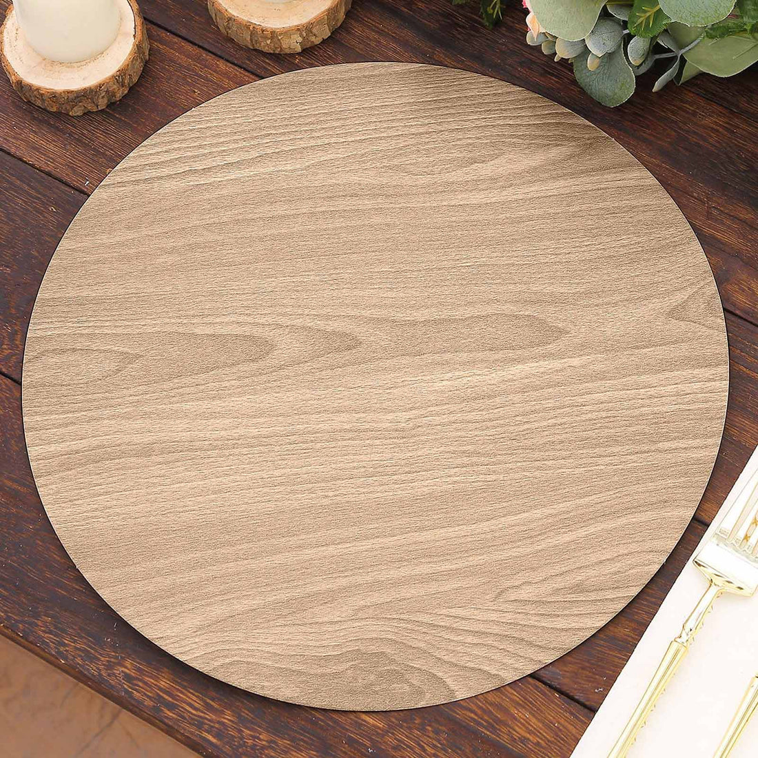 Round wooden placemat in light wood finish on a rustic table.