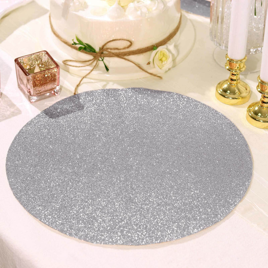 Glittery silver table mat on a festive dining table setting.