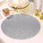 Glittery silver table mat on a festive dining table setting.
