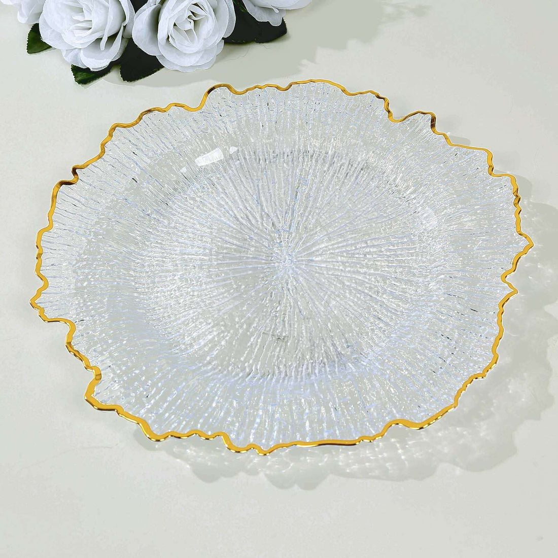 Elegant glass plate with textured design and gold rim